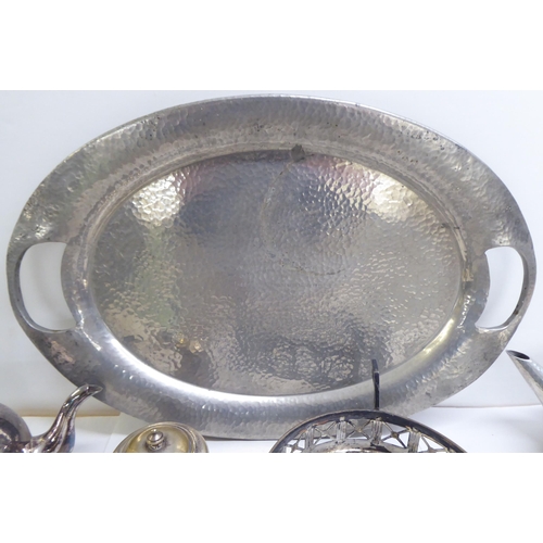 89 - Metalware: to include a spot-hammered pewter, three piece tea set, on a tray  22