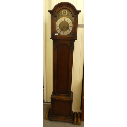 113 - A mid 20thC oak cased longcase clock; the three tone setting movement faced by a brushed steel and b... 