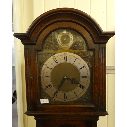 113 - A mid 20thC oak cased longcase clock; the three tone setting movement faced by a brushed steel and b... 