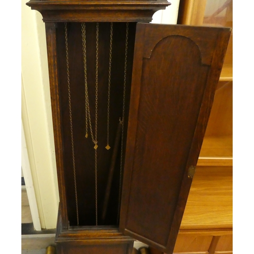 113 - A mid 20thC oak cased longcase clock; the three tone setting movement faced by a brushed steel and b... 