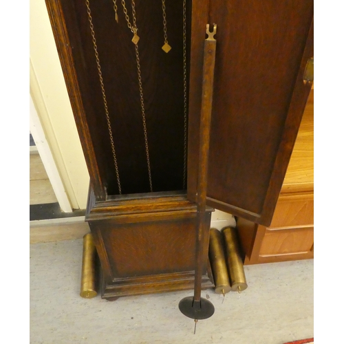 113 - A mid 20thC oak cased longcase clock; the three tone setting movement faced by a brushed steel and b... 