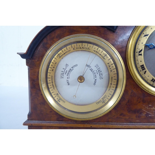 100 - A 20thC walnut cased desktop clock, incorporating a barometer, timepiece and thermometer  7.5