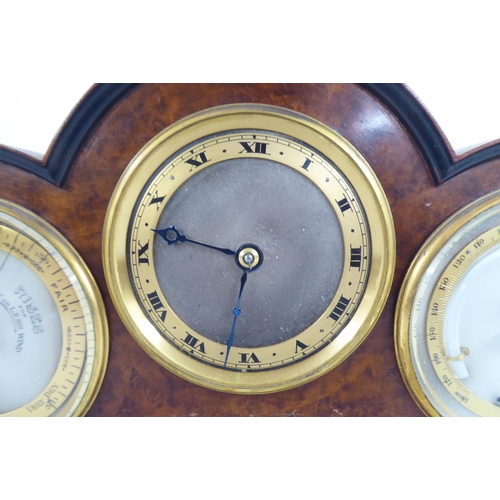 100 - A 20thC walnut cased desktop clock, incorporating a barometer, timepiece and thermometer  7.5