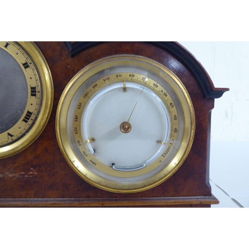 100 - A 20thC walnut cased desktop clock, incorporating a barometer, timepiece and thermometer  7.5