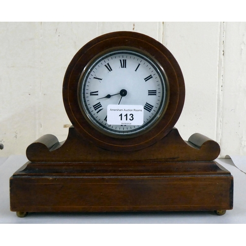 113 - An Edwardian mahogany mantel timepiece; the movement faced by a Roman dial  8