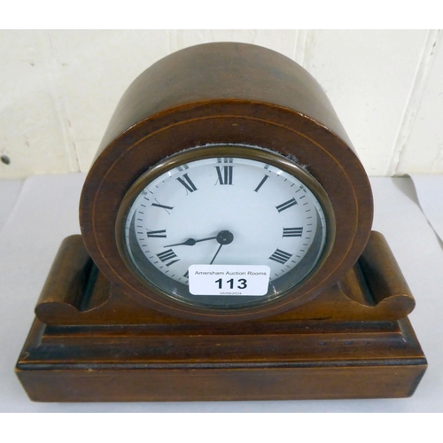 113 - An Edwardian mahogany mantel timepiece; the movement faced by a Roman dial  8