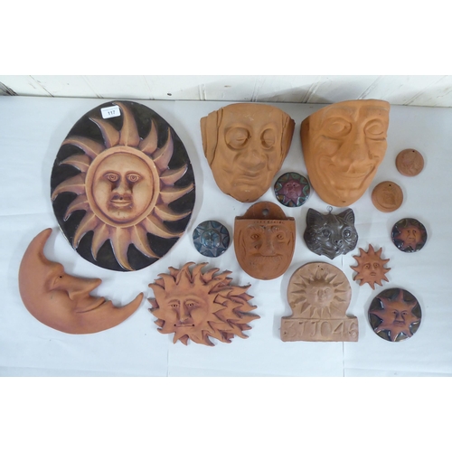 117 - Sun Ceramics of Wales wall art; and other, mainly terracotta, sun, moon and mask wall art  mixe... 