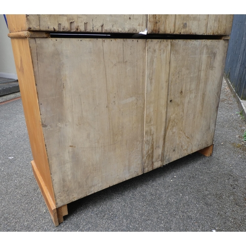 124 - A late Victorian Heal & Son, London pine linen press with a moulded cornice and a pair of panell... 