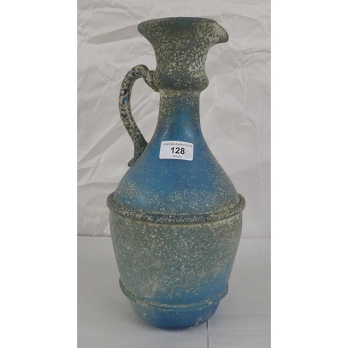 128 - An 'antique' finished, blue glass ewer  13.5