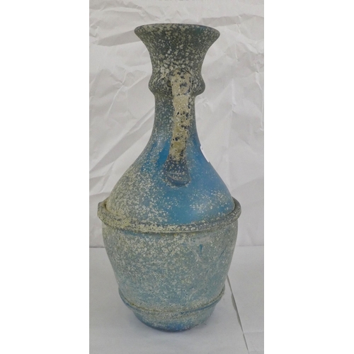 128 - An 'antique' finished, blue glass ewer  13.5