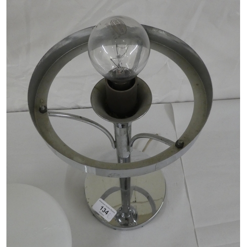 134 - An Art Deco inspired chromium plated table lamp with a milk glass shade  14