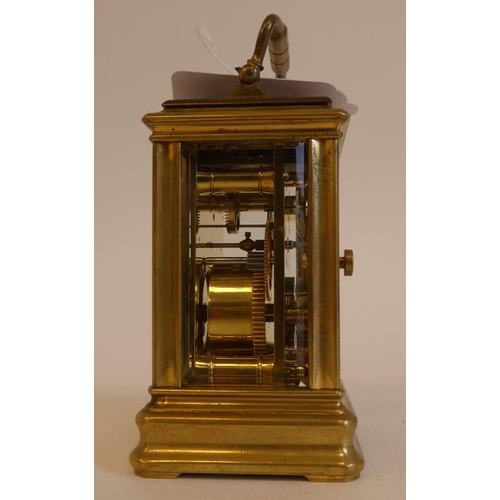 152 - An early 20thC lacquered brass cased miniature carriage timepiece with bevelled glass panels and a f... 