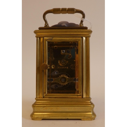 152 - An early 20thC lacquered brass cased miniature carriage timepiece with bevelled glass panels and a f... 