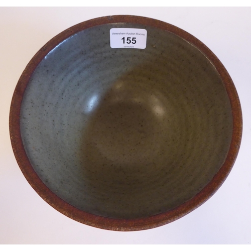 155 - In the manner of Bernard Leach - a pottery bowl with a green glazed interior  bears an impresse... 