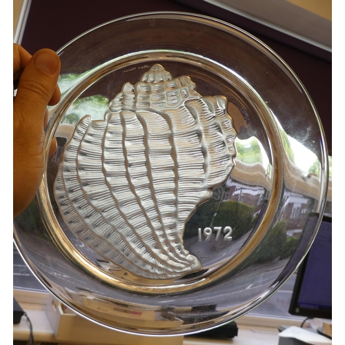 157 - A series of four Lalique Crystal Year plates, viz. '1971 Owl Hibou; '1972 Conch Shell'; '1973 The Ja... 