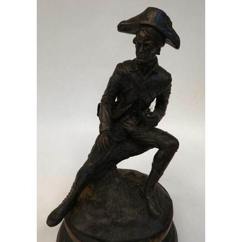 158 - After Rancoulet - a cast and patinated bronze figure, an 18thC soldier wearing a tricorn hat, seated... 