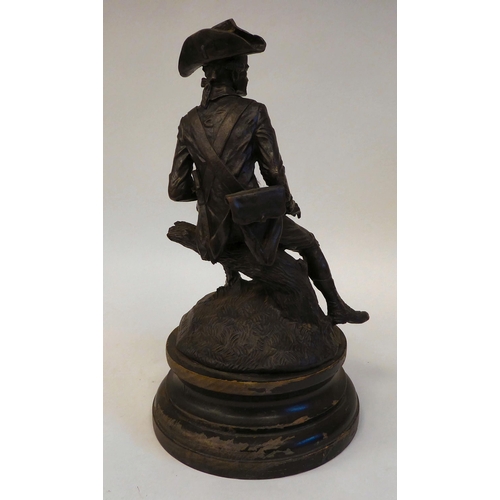 158 - After Rancoulet - a cast and patinated bronze figure, an 18thC soldier wearing a tricorn hat, seated... 