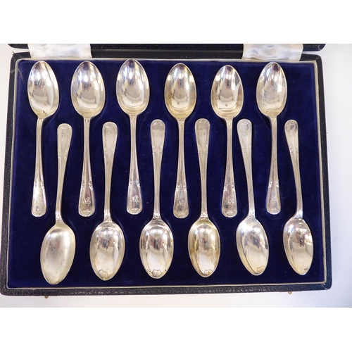 161 - A set of twelve silver teaspoons with ribbon tied wire stems  Walker & Hall  Sheffield... 