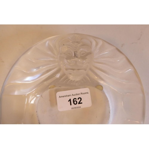 162 - A Lalique part-frosted crystal ashtray 'Tete de Lion'  bears an etched Lalique, France signatur... 