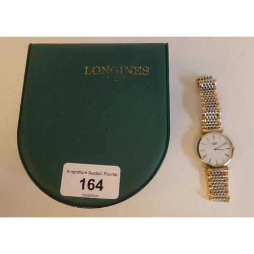 164 - A Longines La Grande Classique bi-coloured, stainless steel cased bracelet wristwatch, faced by a Ro... 