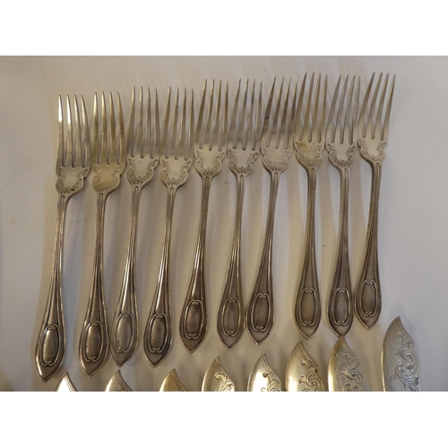 166 - A set of ten silver fish knives and forks with engraved blades and C-scrolled handles  Walker &... 