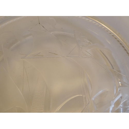 167 - A Lalique crystal ashtray, featuring a longboat under sail  bears an etched Lalique, France sig... 