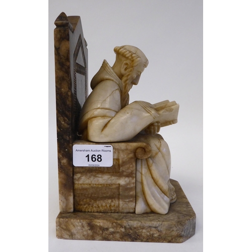 168 - A 19thC carved alabaster figure, depicting a bearded monk, seated on a throne chair, studying a book... 