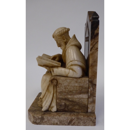 168 - A 19thC carved alabaster figure, depicting a bearded monk, seated on a throne chair, studying a book... 