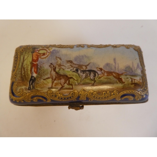 169 - A 19thC enamelled, painted and gilded, oblong patch box, the hinged lid depicting a huntsman and hou... 