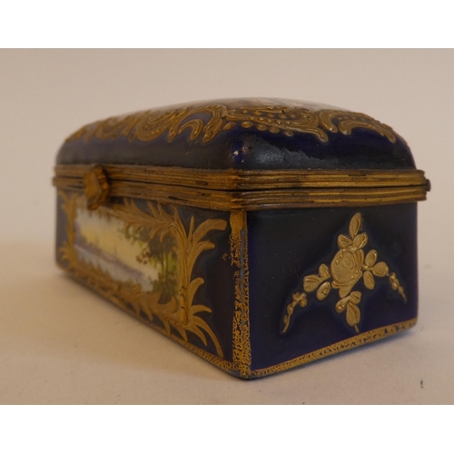 169 - A 19thC enamelled, painted and gilded, oblong patch box, the hinged lid depicting a huntsman and hou... 