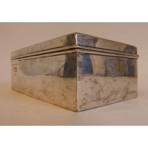 170 - A silver cigarette box with straight sides and a domed, hinged lid, enclosing a cedar lined interior... 