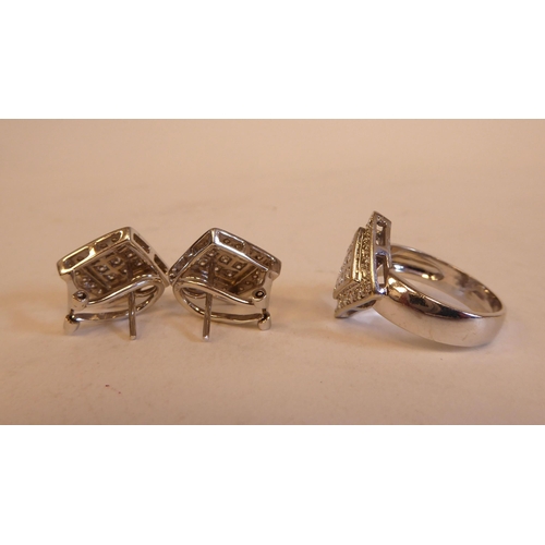 183 - A pair of white coloured gold and diamond set earrings  stamped 750; and a matching signet style rin... 