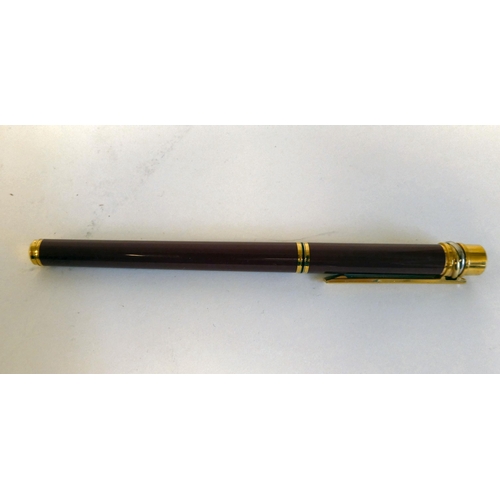 185 - A Must de Cartier gilt and maroon cased fountain pen with an 18k nib  No.041653