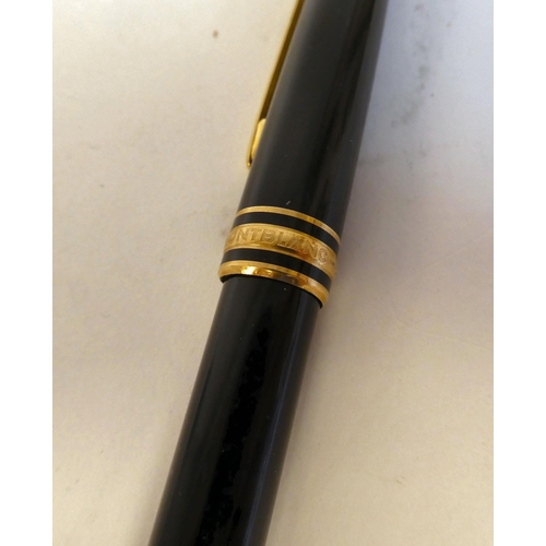 187 - A Mont Blanc bi-coloured stainless steel cased fountain pen, the nib stamped 750/18K; and a Mont Bla... 