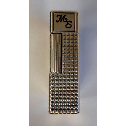 188 - A Dupont gas filled cigarette lighter in textured white metal  impressed IK 2FR23  boxed with certif... 