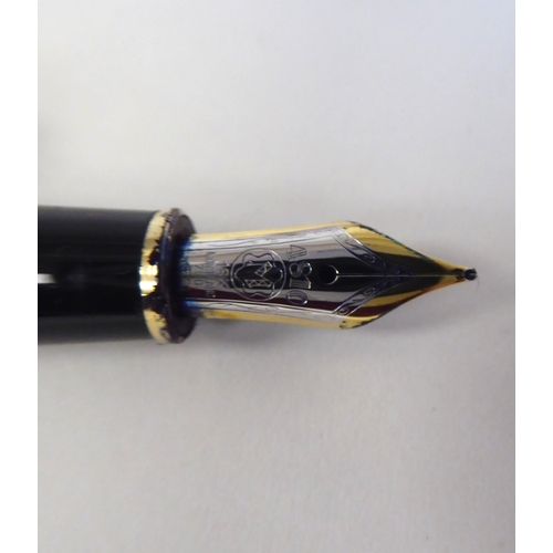 189 - A Mont Blanc bi-coloured and black cased fountain pen  stamped ng 925  boxed with certific... 