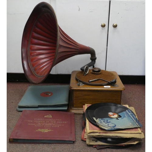 194 - A vintage Edison Bell light oak cased tabletop, wind-up gramophone with a speed regulator, a maroon ... 