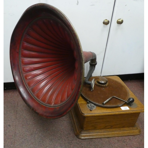 194 - A vintage Edison Bell light oak cased tabletop, wind-up gramophone with a speed regulator, a maroon ... 