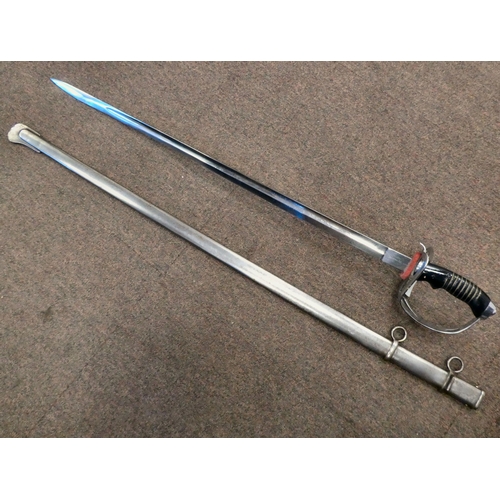 199 - A German infantry sword with an ebonised handle, a pierced knuckle guard and an engraved blade  28.5... 