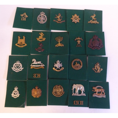 201 - A miscellaneous collection of Regimental cap badges and insignia, each mounted on card and identifie... 