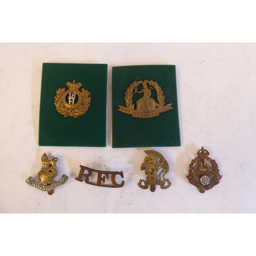 201 - A miscellaneous collection of Regimental cap badges and insignia, each mounted on card and identifie... 