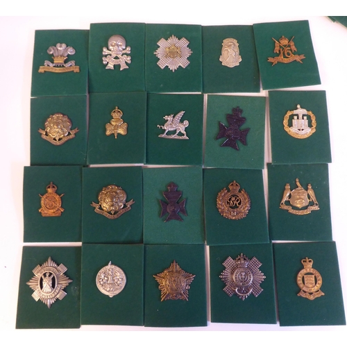 201 - A miscellaneous collection of Regimental cap badges and insignia, each mounted on card and identifie... 