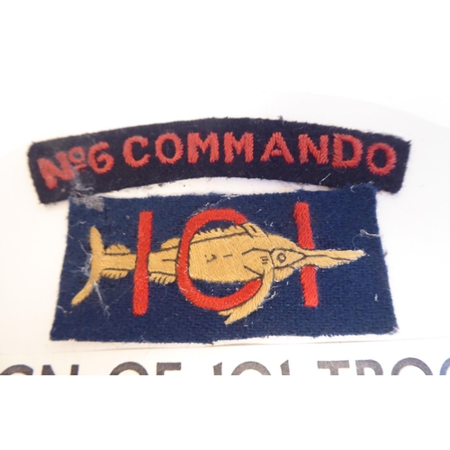 202 - A World War II 101 Troop 6 Commando fabric insignia, mounted on card(Please Note: this lot is subjec... 