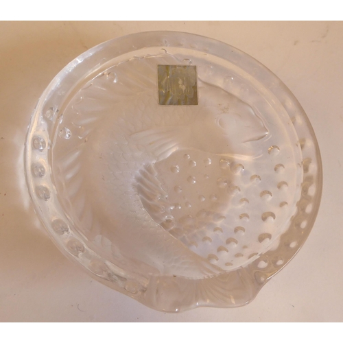 203 - A Lalique part-frosted crystal Pisces ashtray  bears an etched Lalique, France signature and an appl... 