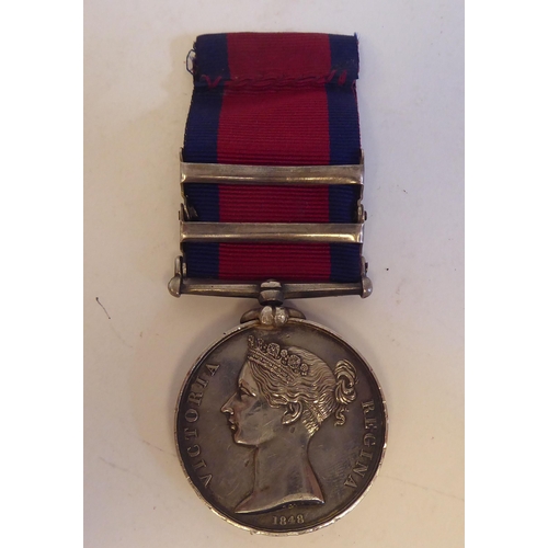 204 - A Victorian military General Service medal, awarded to William May, 57th Regiment Foot with four bar... 