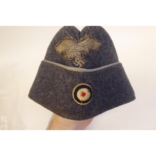 211 - A World War II German Luftwaffe cloth side cap(Please Note: this lot is subject to the statement mad... 