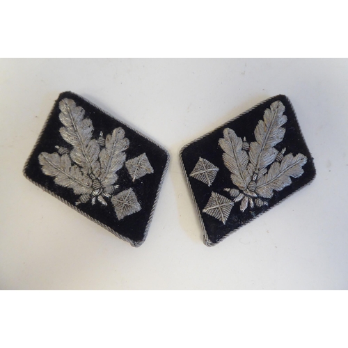 212 - A pair of World War II German SS Officer's silver wire cloth collar patches(Please Note: this lot is... 