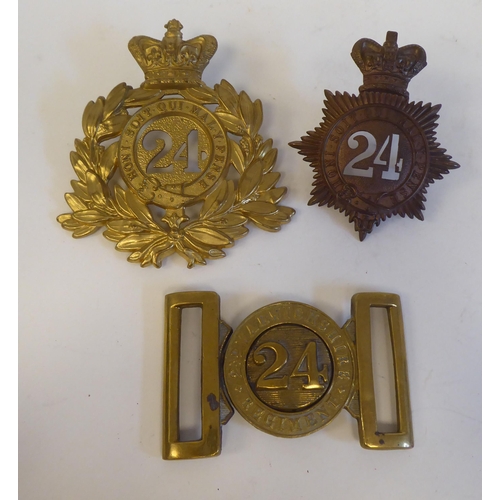 218 - 24th Foot military collectables, viz. two Shako plates; and a belt buckle(Please Note: this lot is s... 