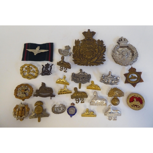 220 - Approximately twenty-five military metal helmet plates and badges, some copies: to include Indian Ar... 