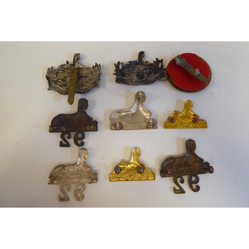 220 - Approximately twenty-five military metal helmet plates and badges, some copies: to include Indian Ar... 